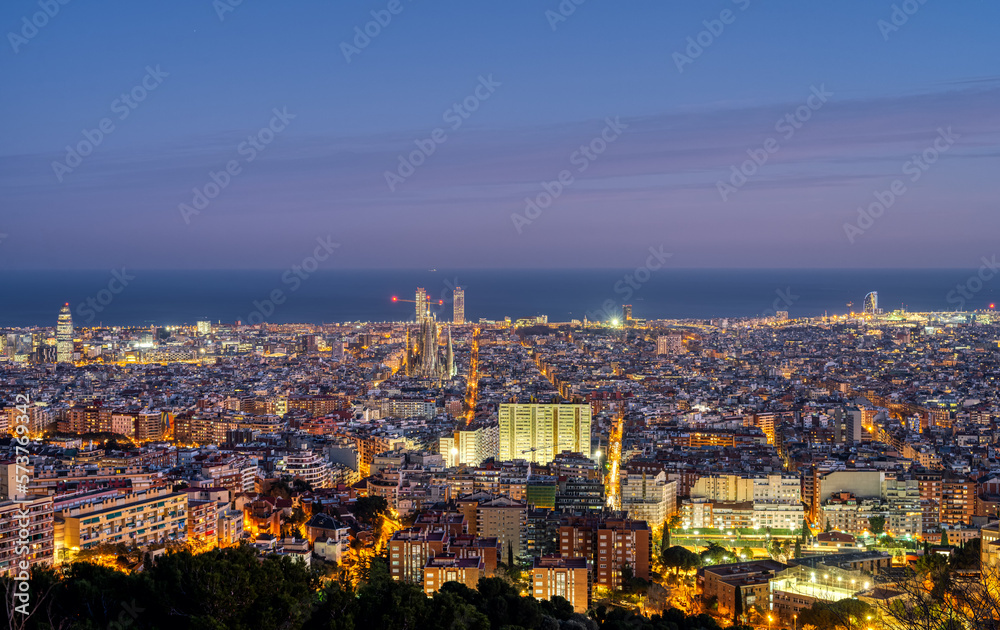 The skyline of Barcelona in Spain at twilight