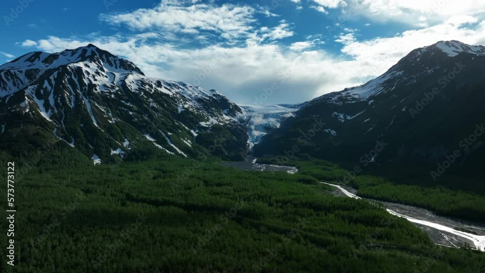Exit Glaciers Down The Mountains At Kenai Fjords National Park In Kenai Peninsula Borough, Alaska. wide aerial Exit Glaciers Down The Mountains At Kenai Fjords National Park In Kenai Peninsula Borough, Alaska. wide aerial