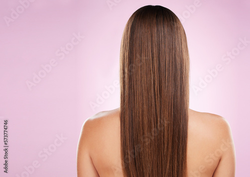 Hair, beauty and woman with back and haircare, mockup space and keratin treatment on pink background. Cosmetics shine, grooming and hairstyle, dandruff free and cosmetic care with female rear view
