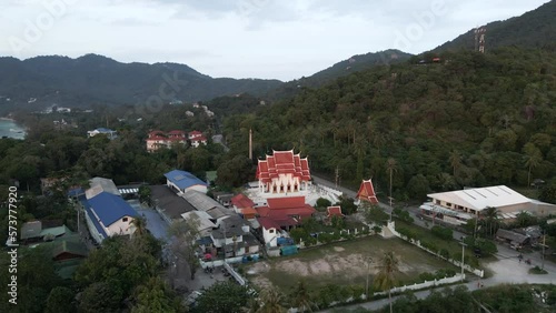 Landscape of a temple with xars passing by in koh tao, souh thailand photo