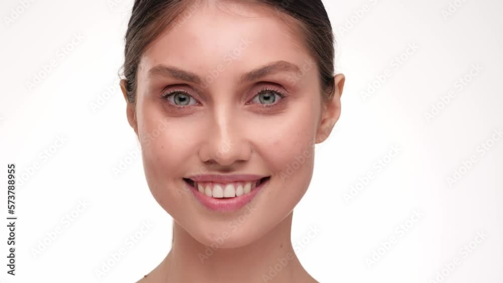 Concept for fresh moisturized elasticity skin. Young woman massaging her face. Girl touching pretty face after applying cream. Natural healthy face. hydrated skin care treatment. slow motion. Concept for fresh moisturized elasticity skin. Young woman massaging her face. Girl touching pretty face after applying cream. Natural healthy face. hydrated skin care treatment. slow motion.