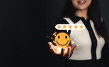Customer service and Satisfaction concept,Businesspeople touching the virtual screen with the happy Smiley face icon and five star to give satisfaction in service,feeling good so happy,good review. ra