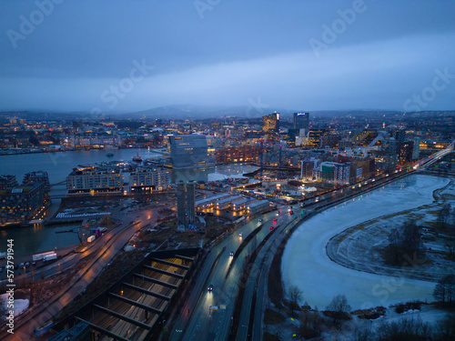 Aerial view of Oslo Downtown Skyline, Norway. Financial district and business centers in smart urban city in Europe. Skyscraper and high-rise buildings at night. © tampatra