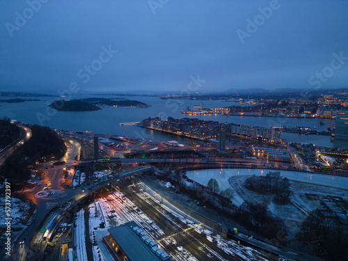 Aerial view of Oslo Downtown Skyline, Norway. Financial district and business centers in smart urban city in Europe. Skyscraper and high-rise buildings at night.