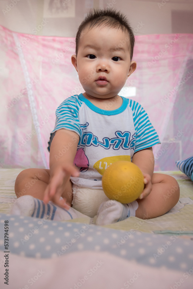 Asia Cute baby playing in bedroom Asia Cute baby playing in bedroom