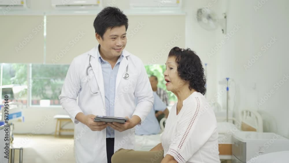 An Asian doctor with a group of old elderly patient or pensioner in nursing home in hospital. Senior people lifestyle activity recreation. Health care physical therapy. An Asian doctor with a group of old elderly patient or pensioner in nursing home in hospital. Senior people lifestyle activity recreation. Health care physical therapy.