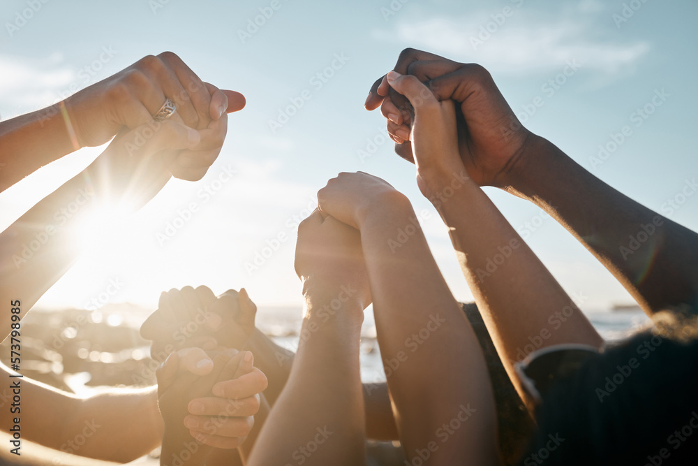 Friends, bonding and holding hands on beach social gathering, community trust support or summer holiday success. Men, women and diversity people in solidarity, team building or travel mission goals - obrazy, fototapety, plakaty 