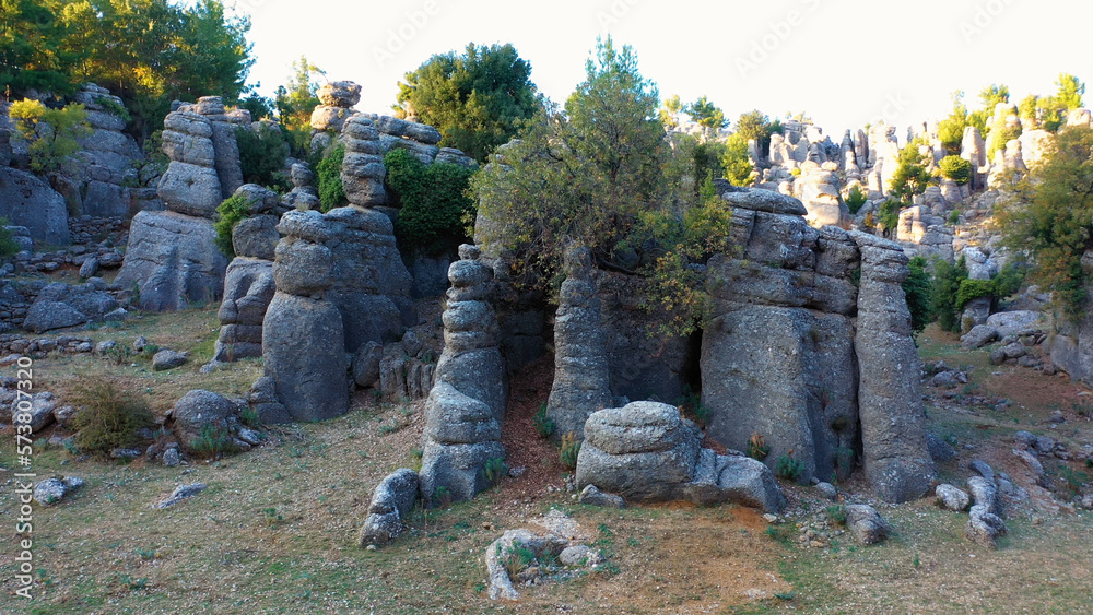 Geological landscape with beautiful rock formations and evergreen trees. Antalya, ancient city of Selge, Adam Kayalar, Turkey.