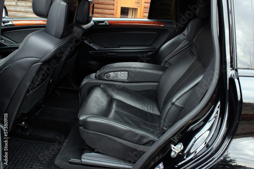 Black leather passenger seat in modern lux car. Black leather car passenger seat. Car leather seats. © Best Auto Photo