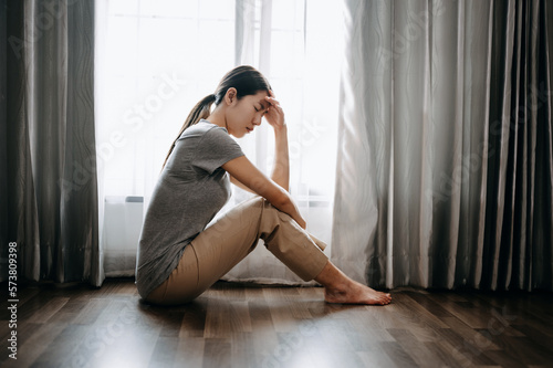 woman sit Depression Dark haired pensive glance Standing by window and anxiety Copy space. ..