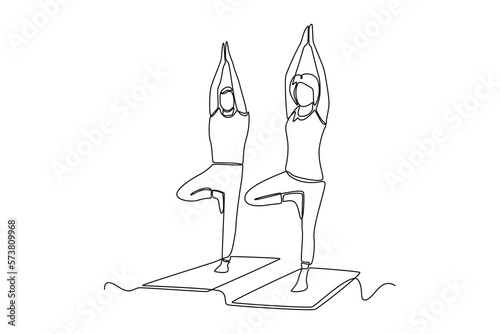 Continuous one line drawing yoga class session. Class in action concept. Single line draw design vector graphic illustration.