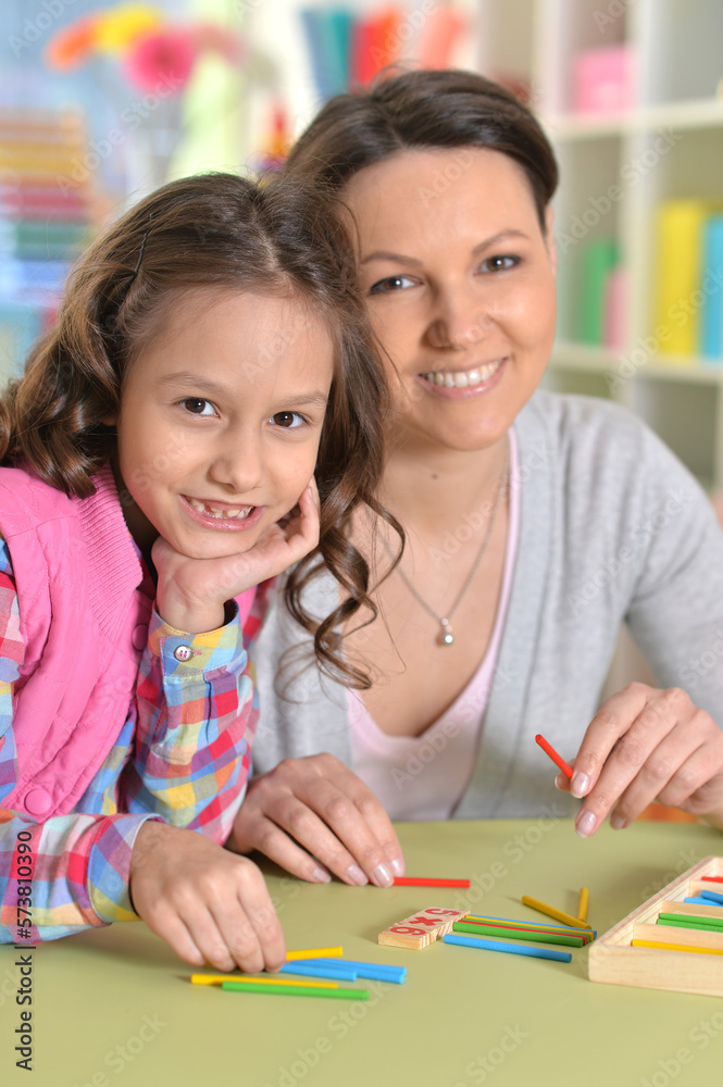 Close-up portrait of a charming little girl with mom Close-up portrait of a charming little girl with mom