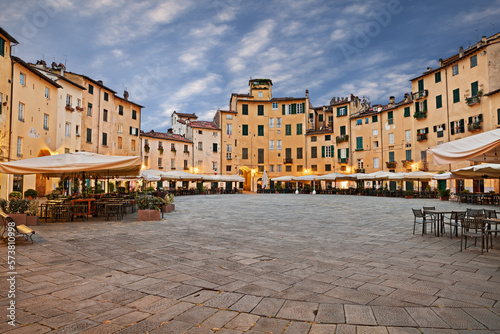 Lucca, Tuscany, Italy: the ancient elliptical Amphitheater square (Piazza dell'anfiteatro) with outdoor bars and restaurants in the old town of the medieval city