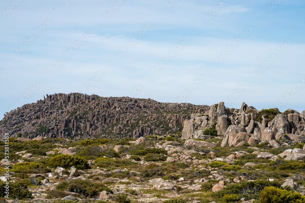 peak of a rocky mountain in a national park looking over a city below, mt wellington hobart tasmania australia