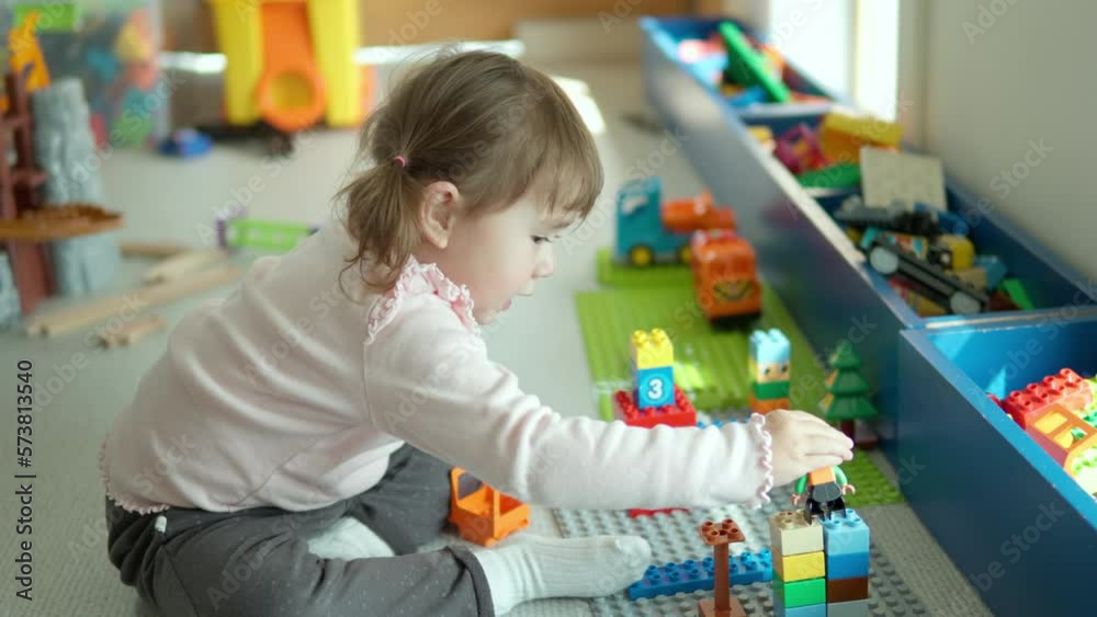 Blond Playful Girl Age 3 Playing with Blocks at Home Playroom Blond Playful Girl Age 3 Playing with Blocks at Home Playroom