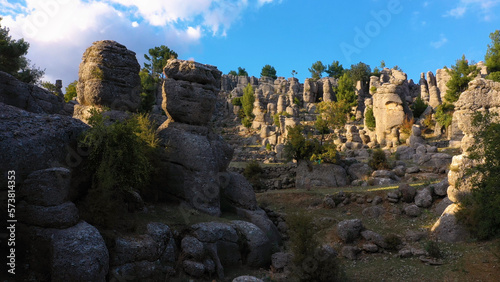 Scenery of amazing rock formations on a sunny summer day. Beautiful nature landscape with a rocky columns.