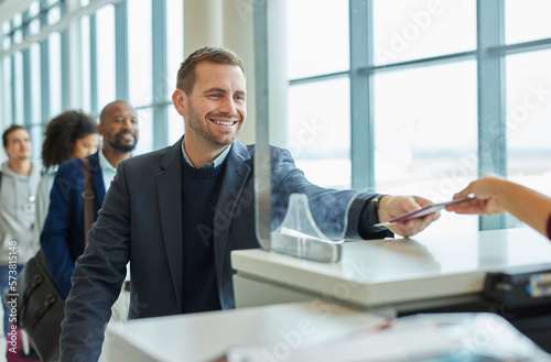 Ticket check, window and business man in airport queue for passport or travel service. Happy customer person at security or consultant booth or counter for transport booking and buying pass at seller © Nina L/peopleimages.com