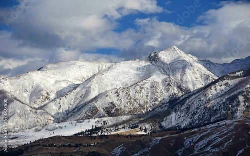 the magnificent peaks of the absaroka range on a sunny winter day along the paradise valley scenic drive between livingston and gardiner, montana  photo