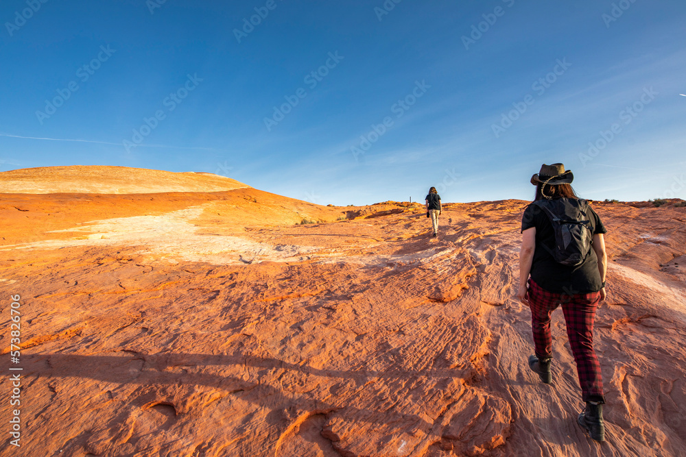 Two women hiking in desert, Valley of Fire State Park, Nevada, USA Two women hiking in desert, Valley of Fire State Park, Nevada, USA