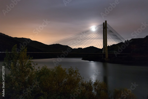 Reservoir bridge of Barrios de Luna, LeÃ³n. With full moon.