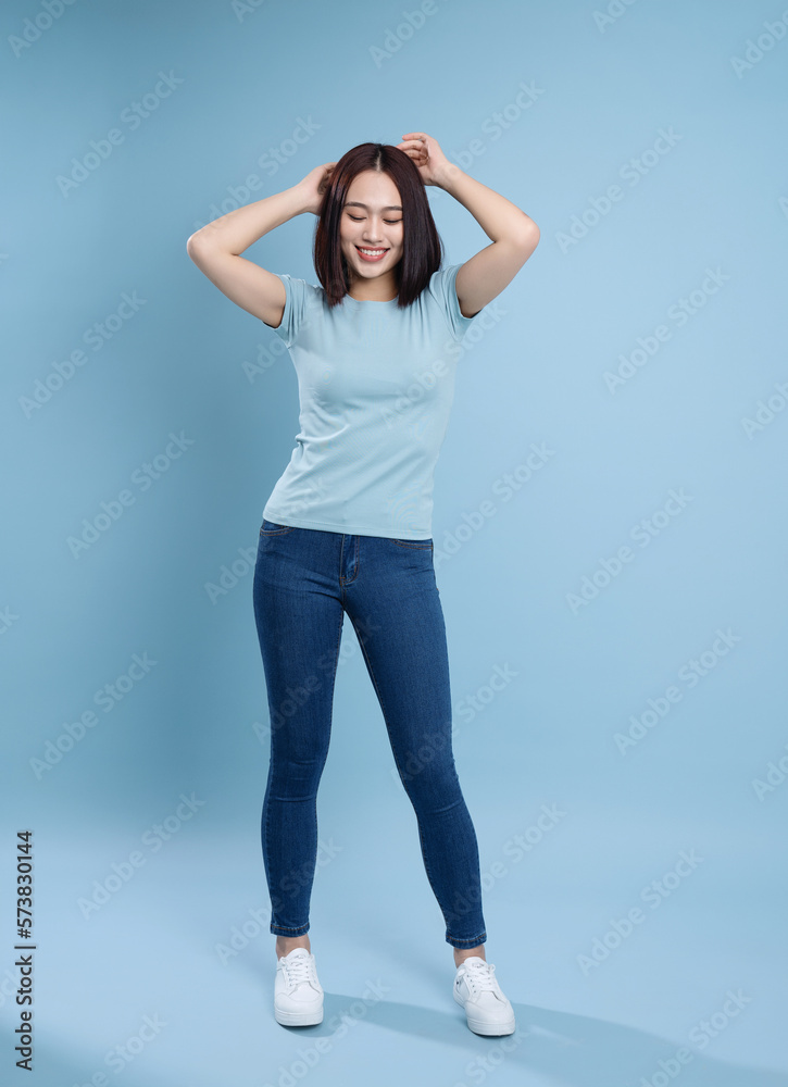 Image of young Asian woman posing on background Image of young Asian woman posing on background
