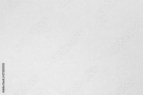 White recycled craft paper texture as background. Grey paper texture  Old vintage page or grunge vignette of old cardboard. 