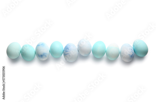 Row of painted Easter eggs on white background