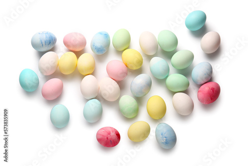 Painted and natural Easter eggs on white background