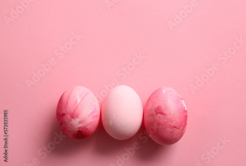 Beautiful painted Easter eggs on pink background