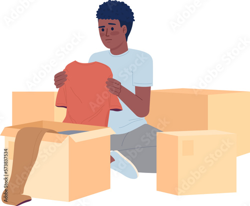 Teen boy decluttering clothes in boxes semi flat color vector character. Editable figure. Full body person on white. Simple cartoon style spot illustration for web graphic design and animation