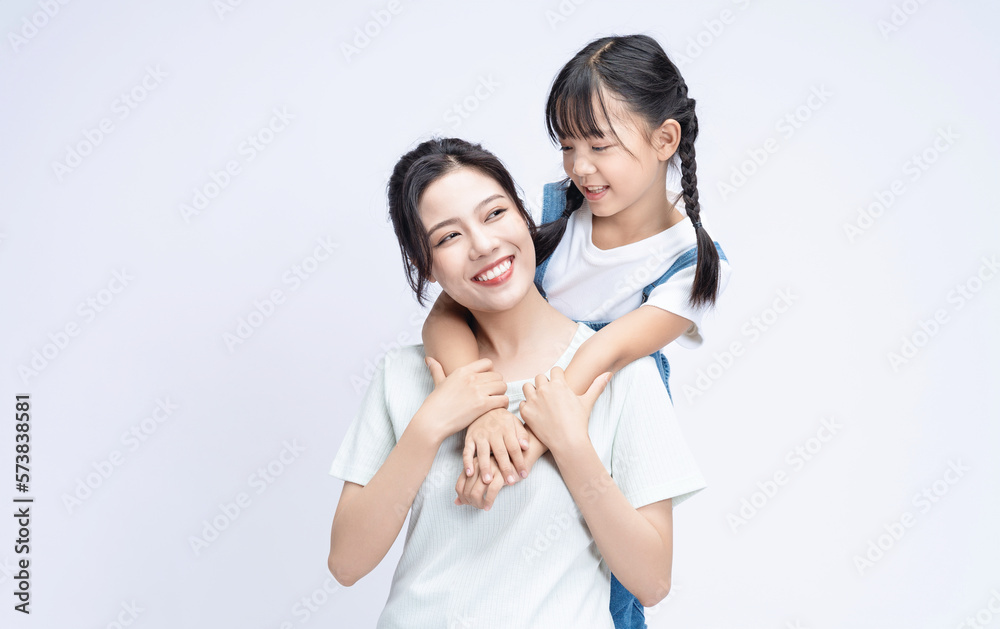 Image of Asian mother and daughter on background Image of Asian mother and daughter on background