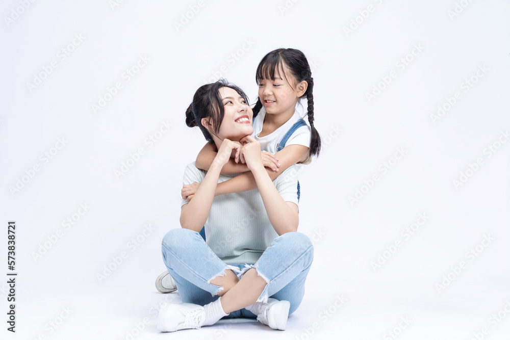Image of Asian mother and daughter on background Image of Asian mother and daughter on background