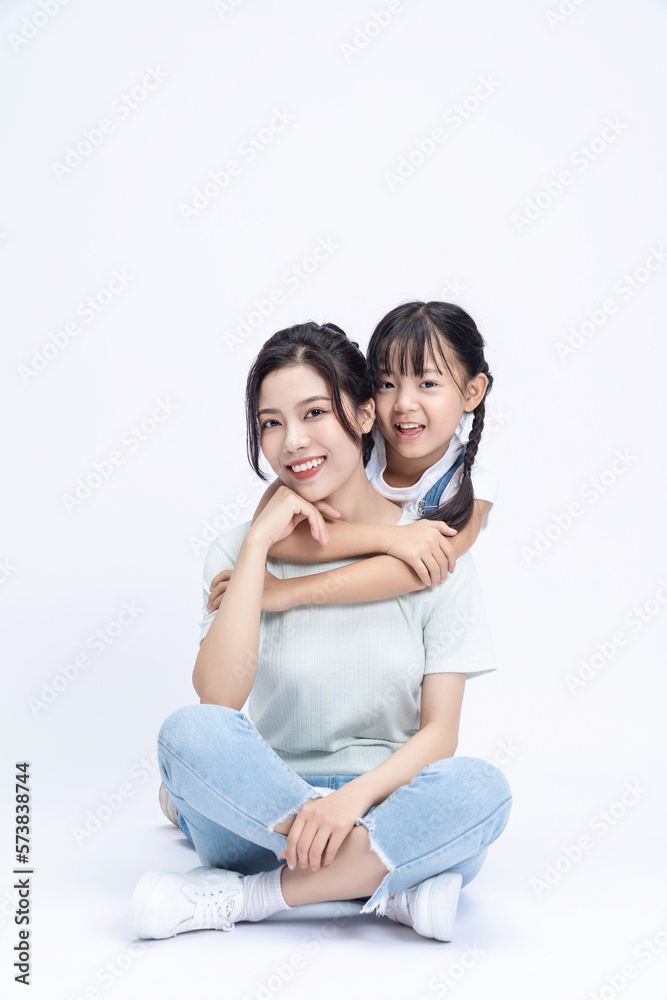 Image of Asian mother and daughter on background Image of Asian mother and daughter on background