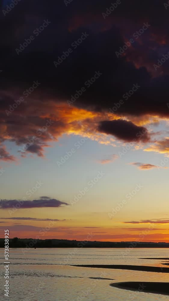Dramatic red sunset river landscape, zoom timelapse. Vertical video Dramatic red sunset river landscape, zoom timelapse. Vertical video