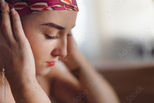 Portrait of unhappy pensive woman with cancer.