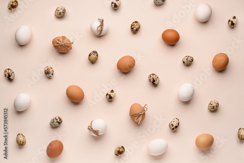 Different Easter eggs on pink background