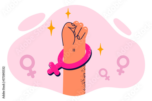 Fist with symbol of Venus symbolizes feminist protest and protection of women rights in fight photo
