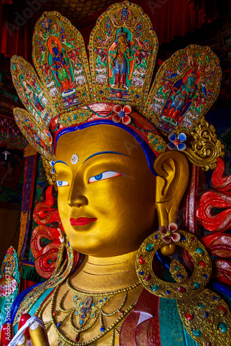 Beautiful and colorful golden buddha statue that call Maitreya Buddha statue in the Thiksey monastery temple.Respectful Buddha image in Ladakh, India.Art of Asia in vintage style.