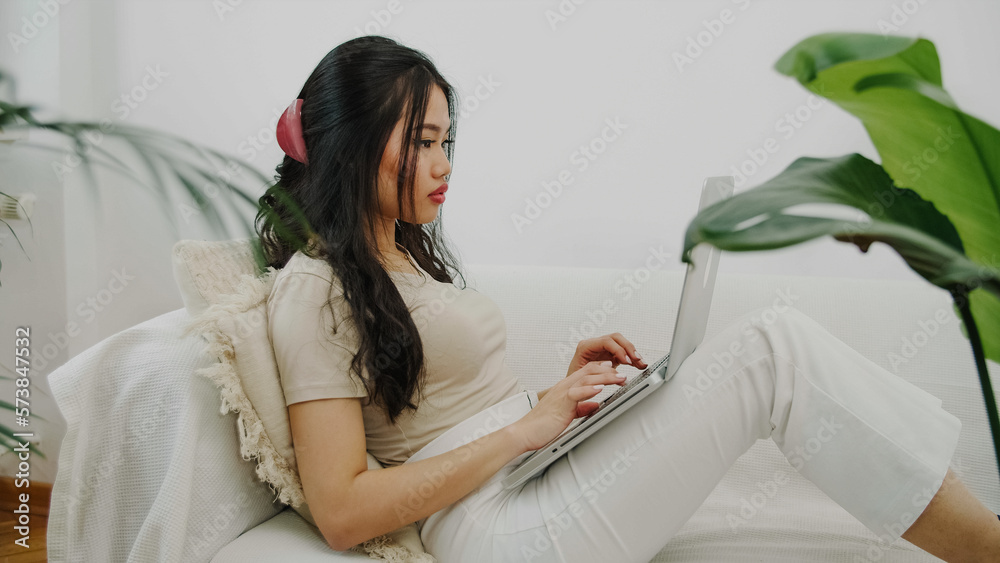 Young blonde woman working with computer at home. Young blonde woman working with computer at home.
