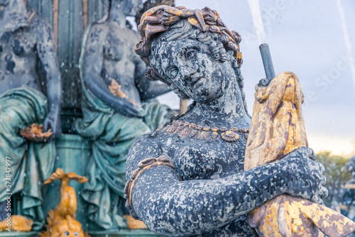 Фотография Close up on a naiad of a water fountain on the Place de la Concorde square in Pa