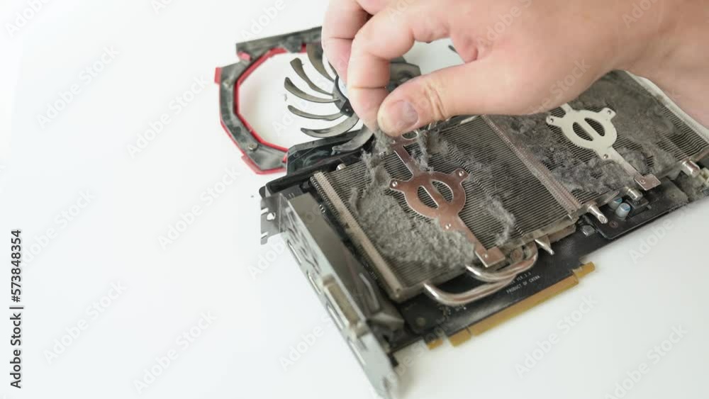 Vidéo Stock Cleaning the computer video card from caked dust. Closeup