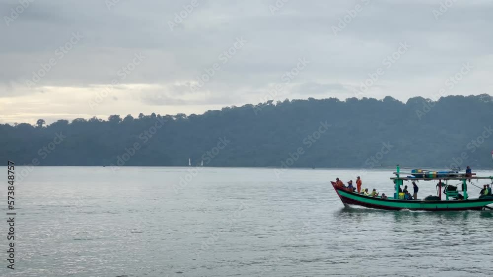 fishing boats go out to sea in the morning. fishing boats go out to sea in the morning.