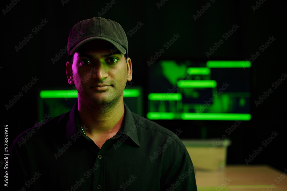 Portrait of Hacker Standing in Server Room Portrait of Hacker Standing in Server Room
