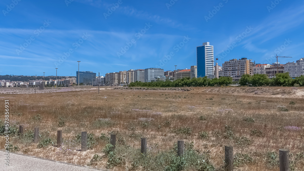 Panoramic view of Figueira da Foz, Claridade beach with pedestrian walkways and main Brazil avenue, along the seafront with buildings Panoramic view of Figueira da Foz, Claridade beach with pedestrian walkways and main Brazil avenue, along the seafront with buildings