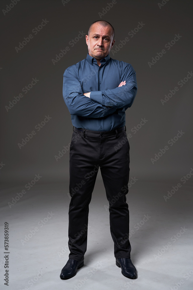 Pensive mature businessman on gray Pensive mature businessman on gray
