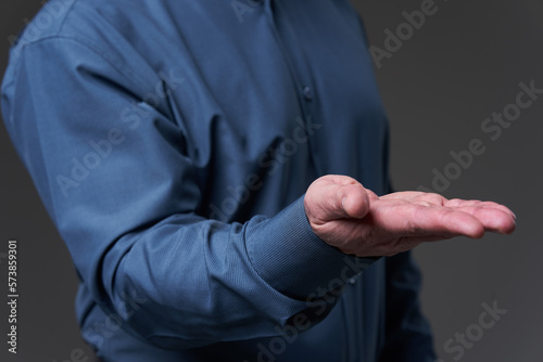 Hand of a businessman offering or requesting