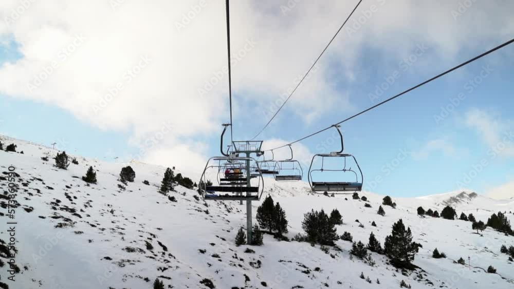 POV sitting in ski resort ski lift looking out across fresh snow on Andorra resort mountain POV sitting in ski resort ski lift looking out across fresh snow on Andorra resort mountain