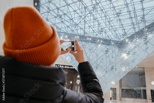 Photos Young woman taking a photo