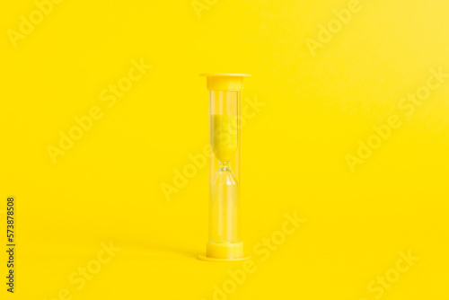 hourglass on the table, sand clock as time passing concept for business deadline, copy space