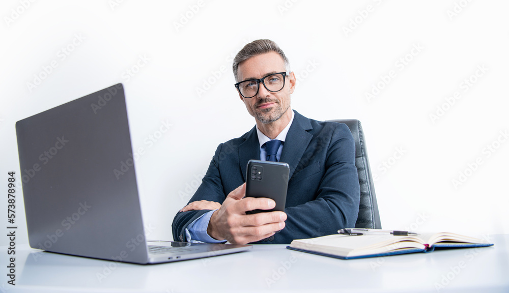 busy businessman in eyewear using phone in office with laptop busy businessman in eyewear using phone in office with laptop
